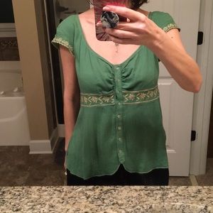 Green top with feminine detail